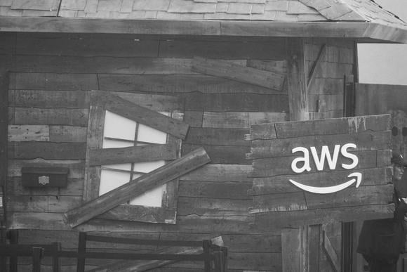 A haunted house with the Amazon Web Services (AWS) logo