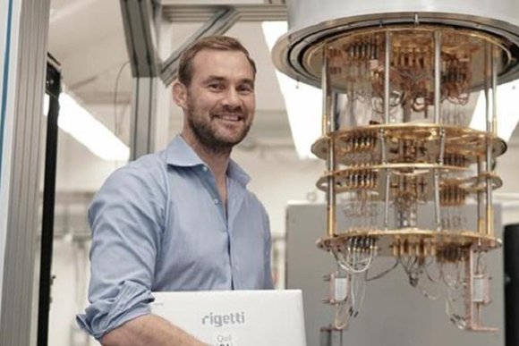 Chad Rigetti near one of his quantum computers .jpg