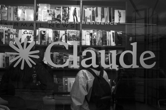 Anthropic's Claude logo on a shop window (Black & White)