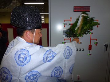 Shinto priest blessing a power distribution panel at Inzai 2