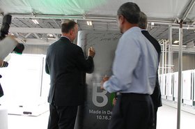 Delaware governor Jack Markell signing a Bloom Energy Server.