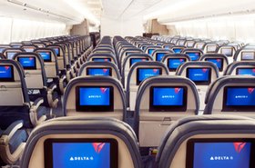 In-flight entertainment screens on a Delta aircraft