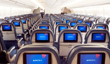 In-flight entertainment screens on a Delta aircraft