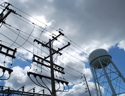 Transmission cables and a cooling tower at a substation.