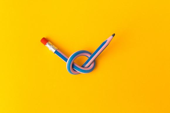 A flexible pencil on a yellow background