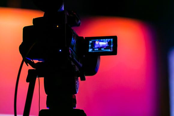 Silhouette of a TV Camera filming a live broadcast