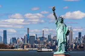 The Statue of Liberty over the Scene of New york cityscape