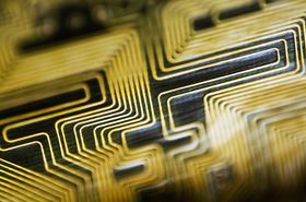 A close-up of a yellow and black circuit board