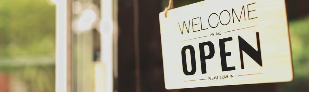 'We are open sign' on a small business