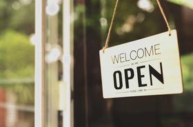 'We are open sign' on a small business