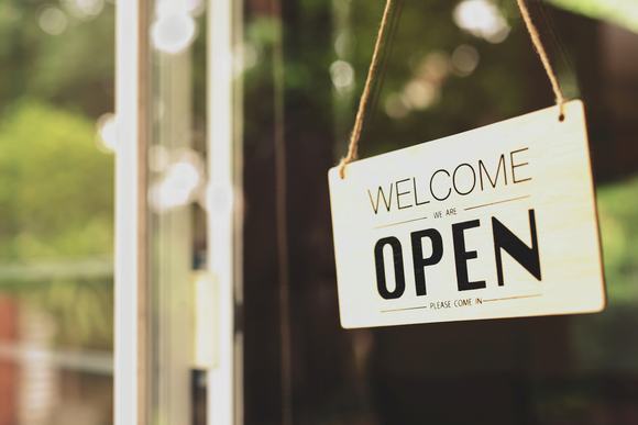 'We are open sign' on a small business
