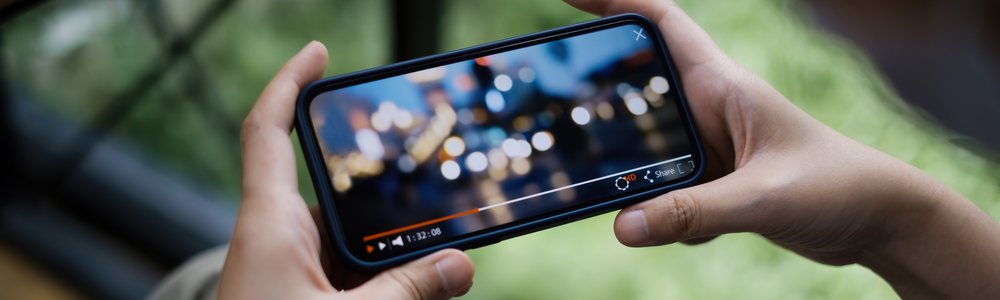 Person watching live stream on smartphone