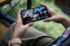 Person watching live stream on smartphone