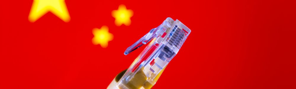 Ethernet cable connector and blurred Chinese flag on the background