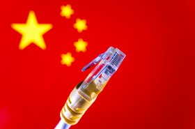 Ethernet cable connector and blurred Chinese flag on the background