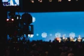 conference being broadcasted live on a news channel