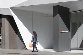 A woman walks past the entrance to the headquarters of Databricks