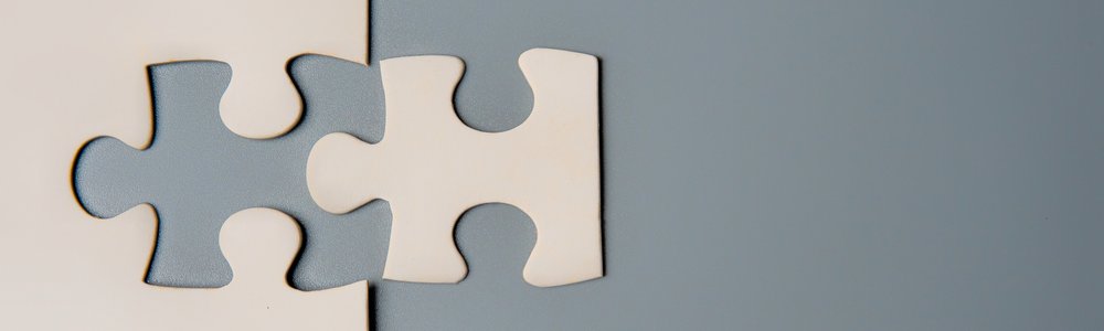 Two puzzle pieces connecting, M&A graphic