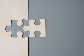 Two puzzle pieces connecting, M&A graphic