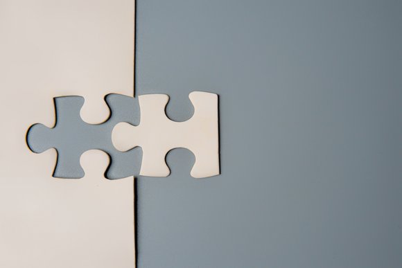 Two puzzle pieces connecting, M&A graphic