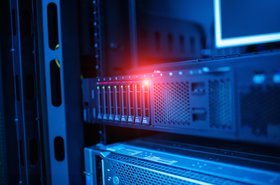 Close-up view of rack-mounted server with LED indicators glowing