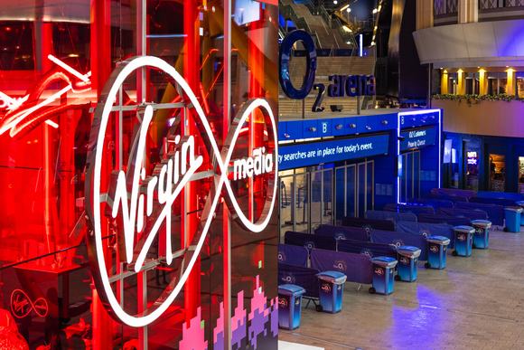 Virgin Media logo illuminated at the O2 Arena entrance