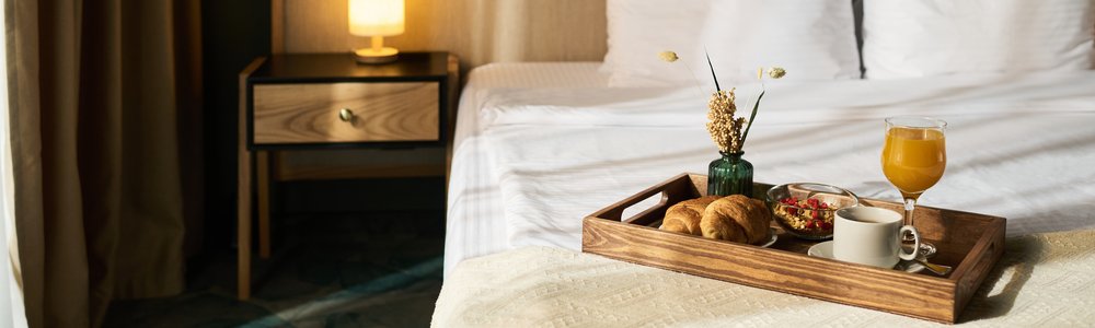 Breakfast Tray on Bed with Elegant Setup in Hotel Room