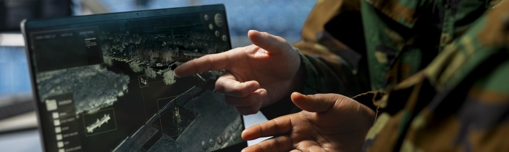 Close up of army experts in data center analyzing infrared surveillance feed