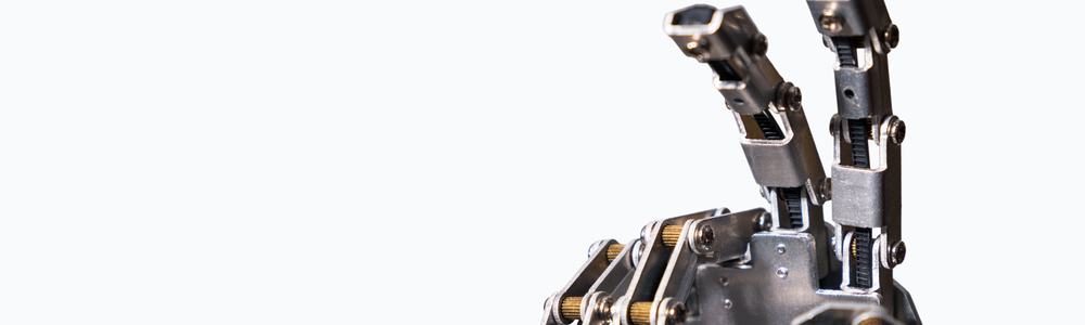 A metal robotic hand making a V sign