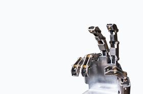 A metal robotic hand making a V sign