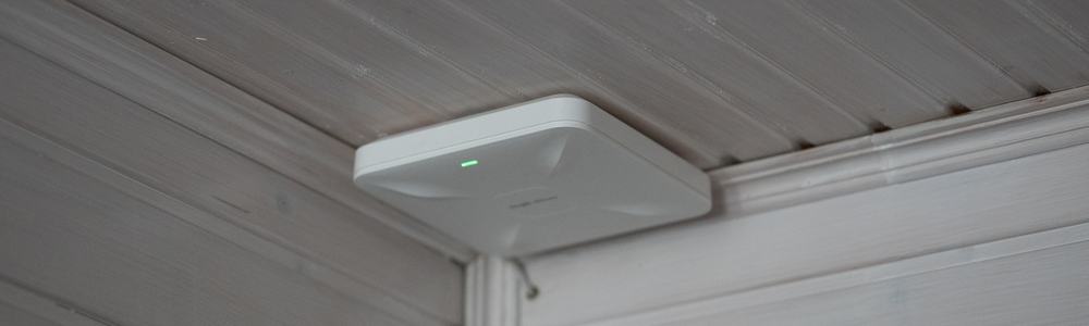 A wireless access point on ceiling in indoor space