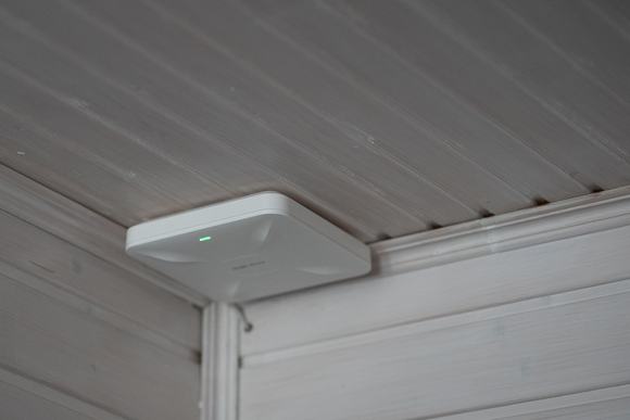 A wireless access point on ceiling in indoor space