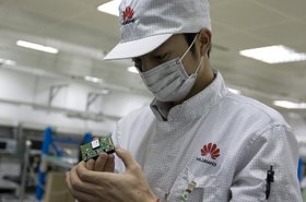 Huawei R&D staff member working in a lab.