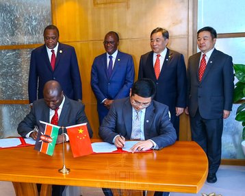 President Uhuru Kenyatta signs the concessional loan