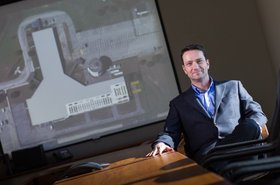 EVP of Operations Mike Tompkins, with the floor plan for the expansion