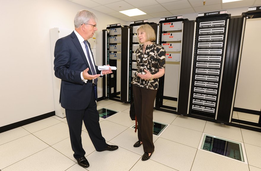iomart's CEO Angus MacSween explains the new technology to UK home secretary Theresa May. Image courtesy of Business Wire.