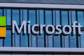 Microsoft logo on the glass front of its office building in Munich, Germany