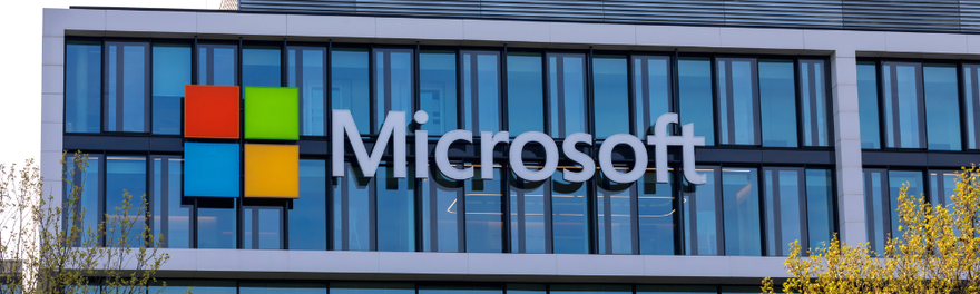Microsoft logo on the glass front of its office building in Munich, Germany