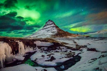 Aurora Borealis above Kirkjuffell in Iceland
