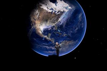 Nvidia CEO Jensen Huang standing in front of the Earth/World/America/USA