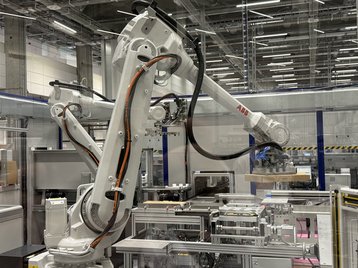 A robotic arm operating on Nokia's Smart New Product Introduction (NPI)