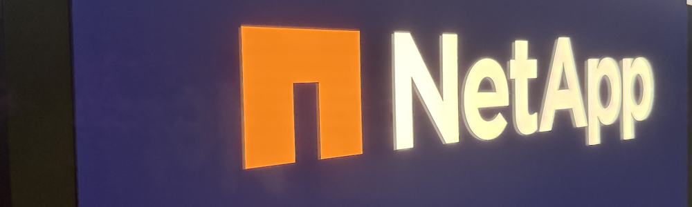 NetApp logo, colorized orange, on display at GTC 2026