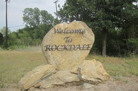 Sign welcoming visitors to Rockdale, TX