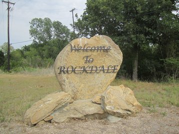 Sign welcoming visitors to Rockdale, TX