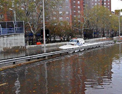 NYPD car driving through East Village, flooded by Hurricane Sandy. By David Shankbone