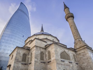 Sehidler Mescidi Mosque and the Flame Towers in Baku, Azerbaijan
