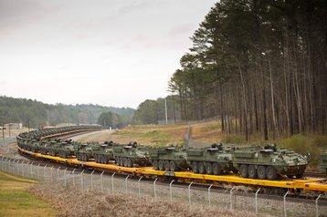 Stryker vehicles on a train