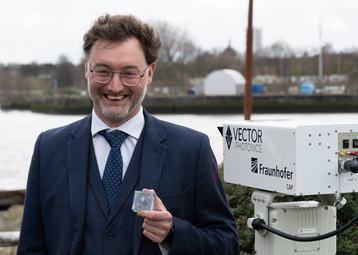 Dr Richard Taylor, CEO and Founder of Vector Photonics, with the PCSEL and optical communications system at the successful demo across the River Clyde.