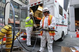 Verizon techs laying fiber cable in Manhattan