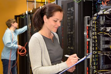 Female data center engineer